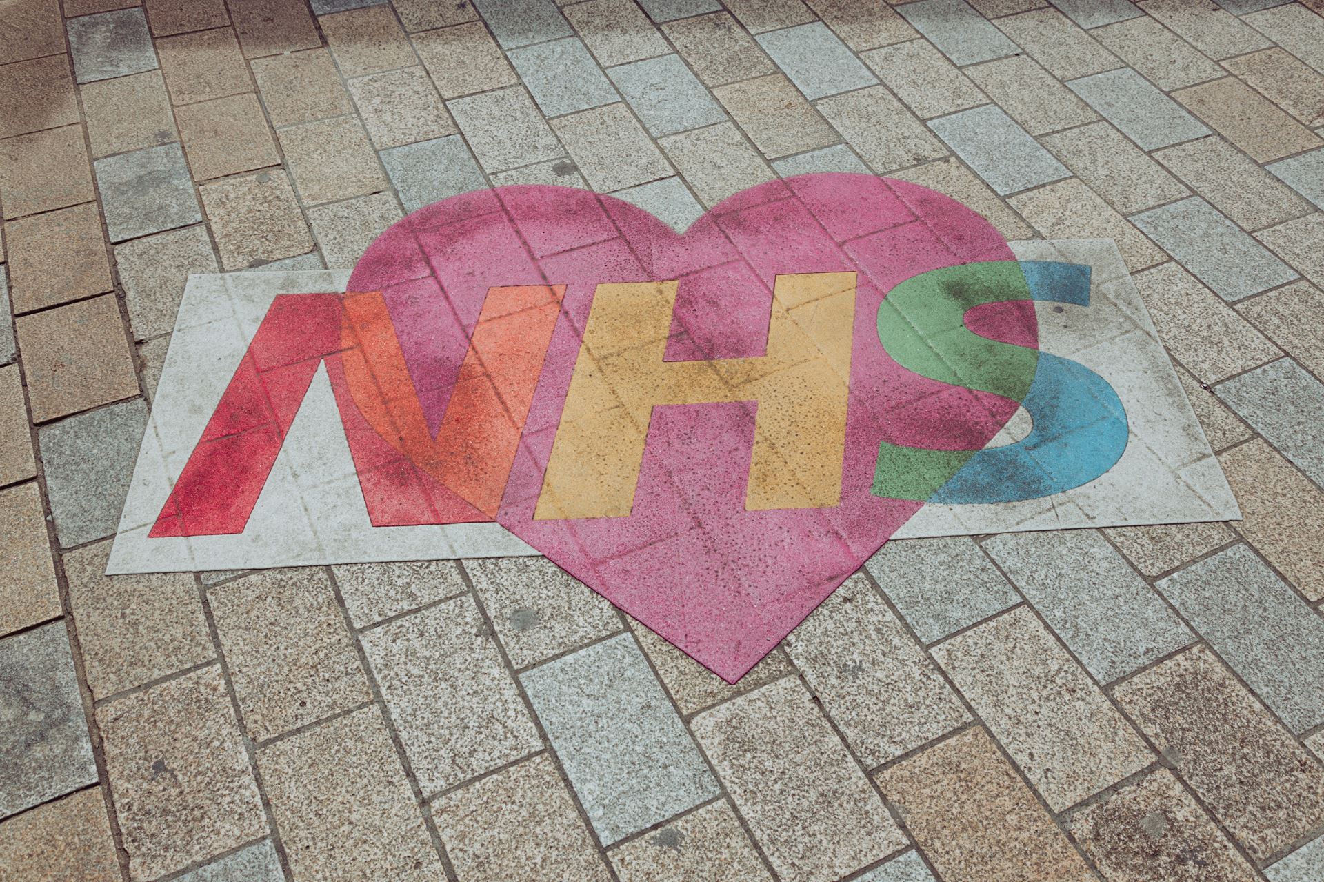 NHS chalked on the floor